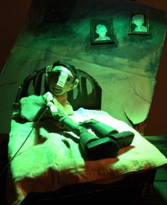 Bedroom scene, as Ball is about to be visited by an errant drone from 2016.