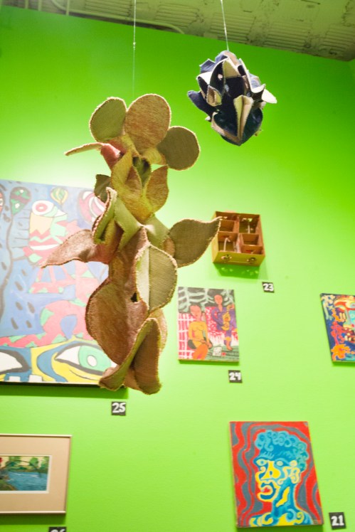 Five "Simple Cell" fibers sculptures by Liz Hammond float in the space.  