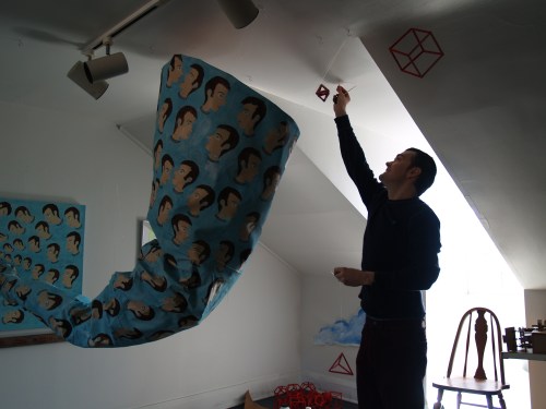 Guest artist Jeremiah Johnson setting up an installation in the attic.
