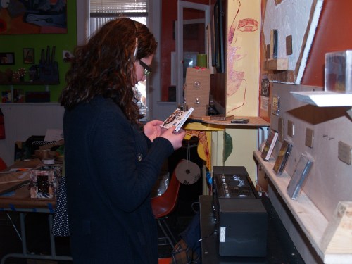 A visitor listens to music during the exhibition, MIXTAPE.  