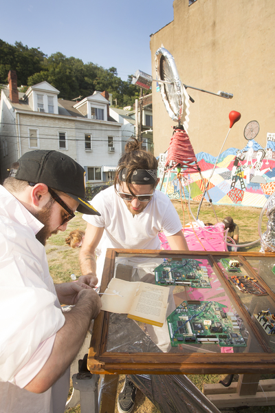 David Zak and Nathan Curtis working meticulously to use all of their provided junk items.